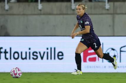 Oct 6, 2023; Louisville, Kentucky, USA; Racing Louisville's Lauren Milliet (2) looks to pass the ball in the first half against the Orlando Pride at Lynn Family Stadium. Mandatory Credit: EM Dash-USA TODAY Sports