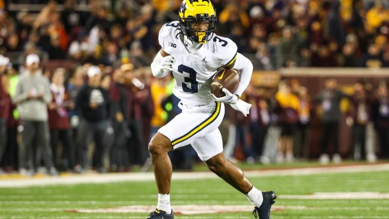 Oct 7, 2023; Minneapolis, Minnesota, USA; Michigan Wolverines defensive back Keon Sabb (3) returns an interception for a touchdown against the Minnesota Golden Gophers during the third quarter at Huntington Bank Stadium. Mandatory Credit: Matt Krohn-USA TODAY Sports