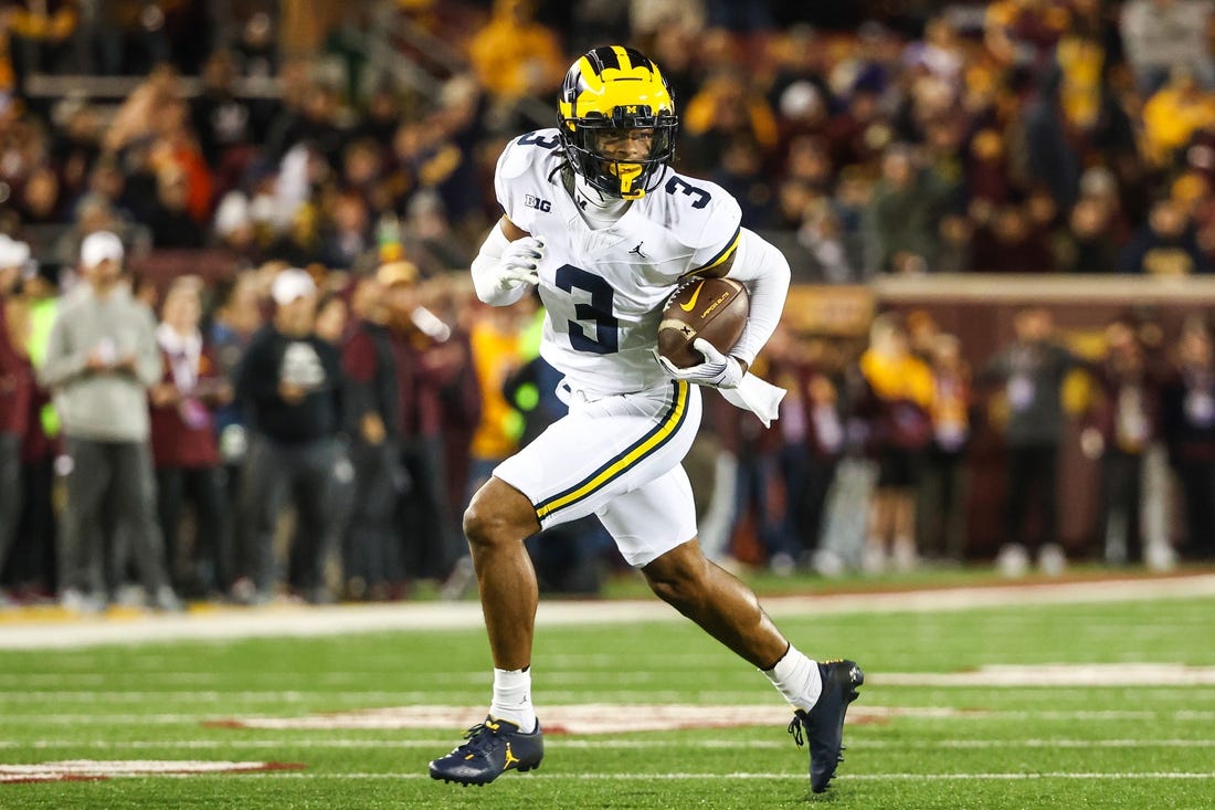 Oct 7, 2023; Minneapolis, Minnesota, USA; Michigan Wolverines defensive back Keon Sabb (3) returns an interception for a touchdown against the Minnesota Golden Gophers during the third quarter at Huntington Bank Stadium. Mandatory Credit: Matt Krohn-USA TODAY Sports