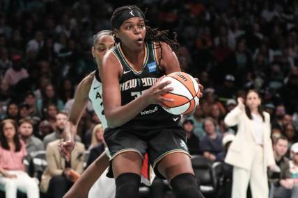 Oct 15, 2023; Brooklyn, New York, USA; New York Liberty forward Jonquel Jones (35) grabs a rebound against the Las Vegas Aces in the second quarter during game three of the 2023 WNBA Finals at Barclays Center. Mandatory Credit: Wendell Cruz-USA TODAY Sports