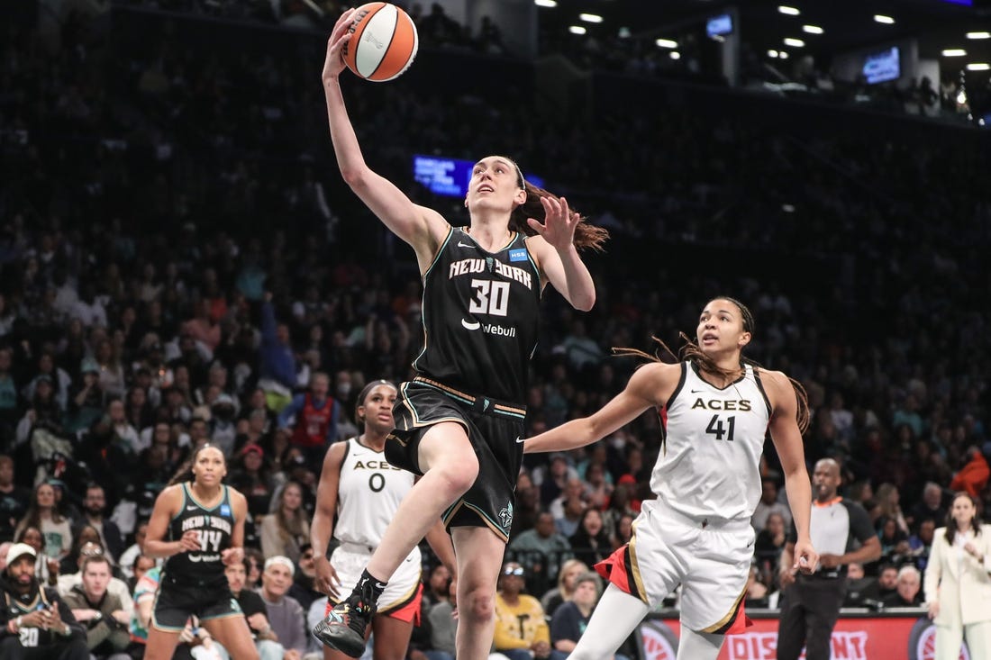 Oct 15, 2023; Brooklyn, New York, USA; New York Liberty forward Breanna Stewart (30) drives past Las Vegas Aces center Kiah Stokes (41) for a layup in the third quarter during game three of the 2023 WNBA Finals at Barclays Center. Mandatory Credit: Wendell Cruz-USA TODAY Sports