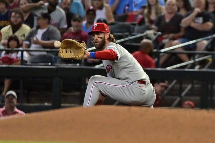 Oct 19, 2023; Phoenix, Arizona, USA; Philadelphia Phillies first baseman Bryce Harper (3) gets an out at first base against the Arizona Diamondbacks in the first inning during game three of the NLCS for the 2023 MLB playoffs at Chase Field. Mandatory Credit: Matt Kartozian-USA TODAY Sports