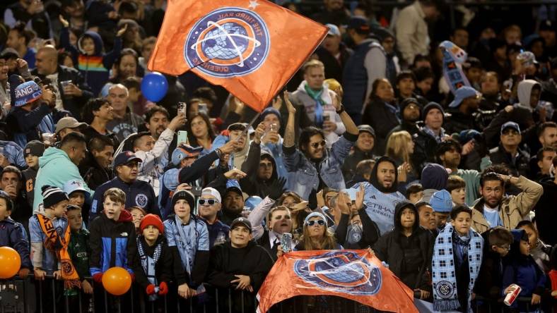 Oct 21, 2023; New York, NY, New York, NY, USA; New York City FC fans celebrate after a goal by forward Julian Fernandez (not pictured) during the second half against the Chicago Fire at Citi Field. Mandatory Credit: Vincent Carchietta-USA TODAY Sports