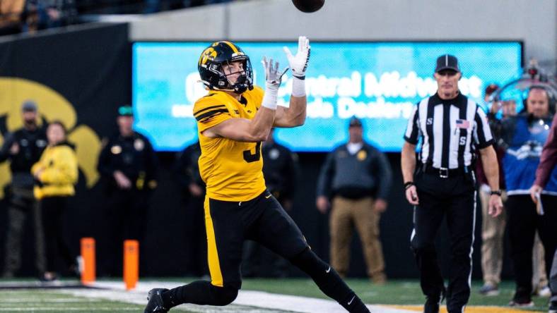 Iowa defensive back Cooper DeJean (3) catches a punt at Kinnick Stadium on Saturday, October 21, 2023 in Iowa City. DeJean returned the punt for a touchdown and it was later called back after review ruled he fair-caught the punt.