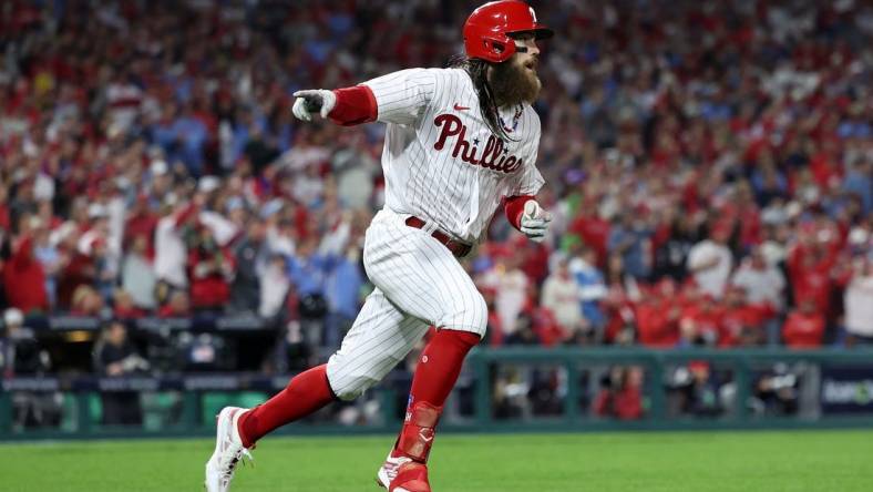 Oct 24, 2023; Philadelphia, Pennsylvania, USA; Philadelphia Phillies center fielder Brandon Marsh (16) reacts after hitting a single in the third inning for game seven of the NLCS for the 2023 MLB playoffs at Citizens Bank Park. Mandatory Credit: Bill Streicher-USA TODAY Sports