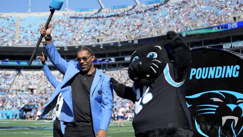 Oct 29, 2023; Charlotte, North Carolina, USA; Former Carolina Panthers great Julius Peppers is honored on the field before the game at Bank of America Stadium. Mandatory Credit: Bob Donnan-USA TODAY Sports