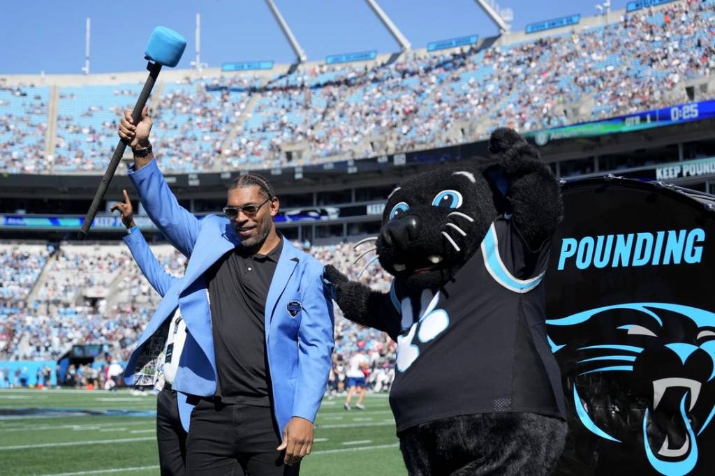 Oct 29, 2023; Charlotte, North Carolina, USA; Former Carolina Panthers great Julius Peppers is honored on the field before the game at Bank of America Stadium. Mandatory Credit: Bob Donnan-USA TODAY Sports