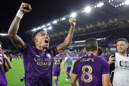 Oct 30, 2023; Orlando, Florida, USA; Orlando City midfielder Junior Urso (21) signals to fans after defeating the Nashville SC of game one in a round one match of the 2023 MLS Cup Playoffs at Exploria Stadium. Mandatory Credit: Nathan Ray Seebeck-USA TODAY Sports