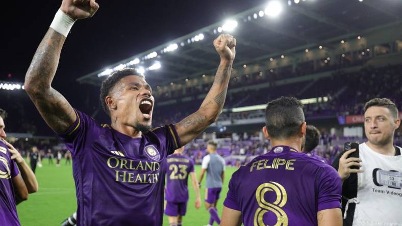 Oct 30, 2023; Orlando, Florida, USA; Orlando City midfielder Junior Urso (21) signals to fans after defeating the Nashville SC of game one in a round one match of the 2023 MLS Cup Playoffs at Exploria Stadium. Mandatory Credit: Nathan Ray Seebeck-USA TODAY Sports