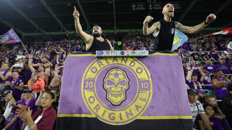 Oct 30, 2023; Orlando, Florida, USA; Orlando City fans celebrate after defeating the Nashville SC of game one in a round one match of the 2023 MLS Cup Playoffs at Exploria Stadium. Mandatory Credit: Nathan Ray Seebeck-USA TODAY Sports