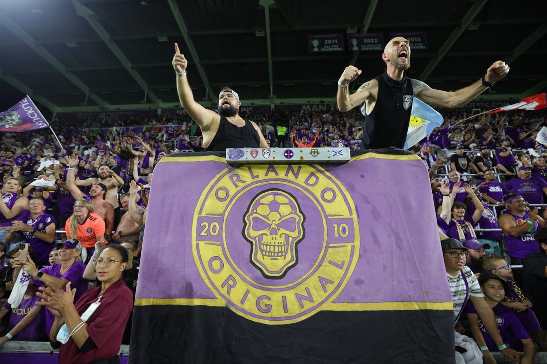 Oct 30, 2023; Orlando, Florida, USA; Orlando City fans celebrate after defeating the Nashville SC of game one in a round one match of the 2023 MLS Cup Playoffs at Exploria Stadium. Mandatory Credit: Nathan Ray Seebeck-USA TODAY Sports