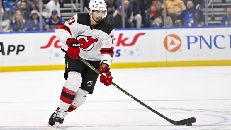 Nov 3, 2023; St. Louis, Missouri, USA;  New Jersey Devils defenseman Jonas Siegenthaler (71) controls the puck against the St. Louis Blues during the first period at Enterprise Center. Mandatory Credit: Jeff Curry-USA TODAY Sports