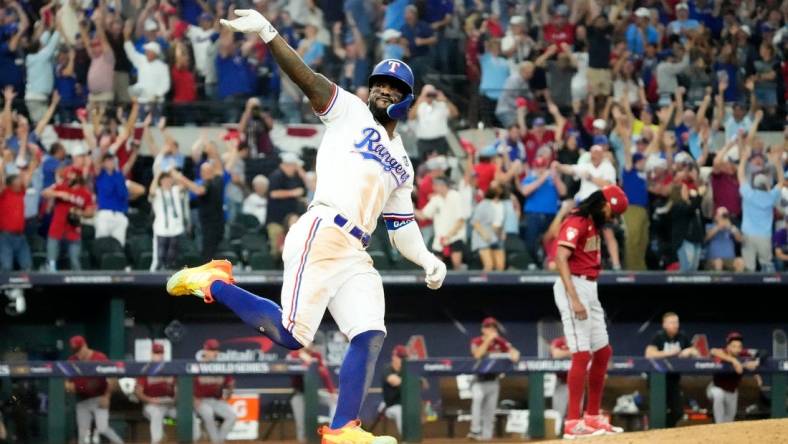 Oct 27, 2023; Arlington, Texas, USA; Texas Rangers Adolis Garcia (53) hits a walk-off home run off Arizona Diamondbacks relief pitcher Miguel Castro (50) in the 11th inning during Game 1 of 2023 World Series at Globe Life Field. Mandatory Credit: Rob Schumacher-Arizona Republic