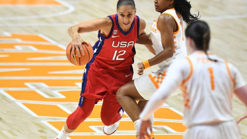 U.S. national team's Diana Taurasi (12) is guarded by Tennessee's Jewel Spear (0) during an exhibition basketball game on Sunday, November 5, 2023 In Knoxville, Tenn.