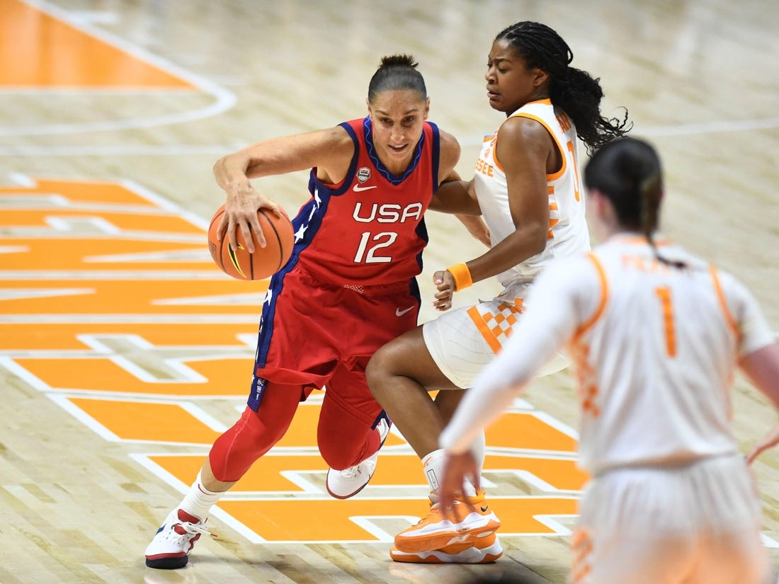 U.S. national team's Diana Taurasi (12) is guarded by Tennessee's Jewel Spear (0) during an exhibition basketball game on Sunday, November 5, 2023 In Knoxville, Tenn.