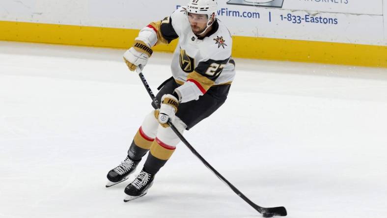 Nov 5, 2023; Anaheim, California, USA; Vegas Golden Knights defenseman Shea Theodore (27) passes during the third period against the Anaheim Ducks at Honda Center. Mandatory Credit: Jason Parkhurst-USA TODAY Sports