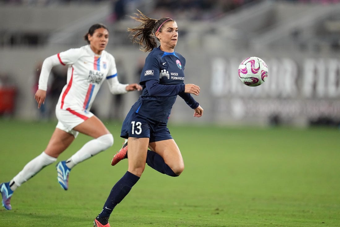 Nov 5, 2023; San Diego, California, USA; San Diego Wave FC forward Alex Morgan (13) controls the ball in the second half against the OL Reign at Snapdragon Stadium. Mandatory Credit: Ray Acevedo-USA TODAY Sports