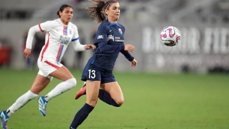 Nov 5, 2023; San Diego, California, USA; San Diego Wave FC forward Alex Morgan (13) controls the ball in the second half against the OL Reign at Snapdragon Stadium. Mandatory Credit: Ray Acevedo-USA TODAY Sports