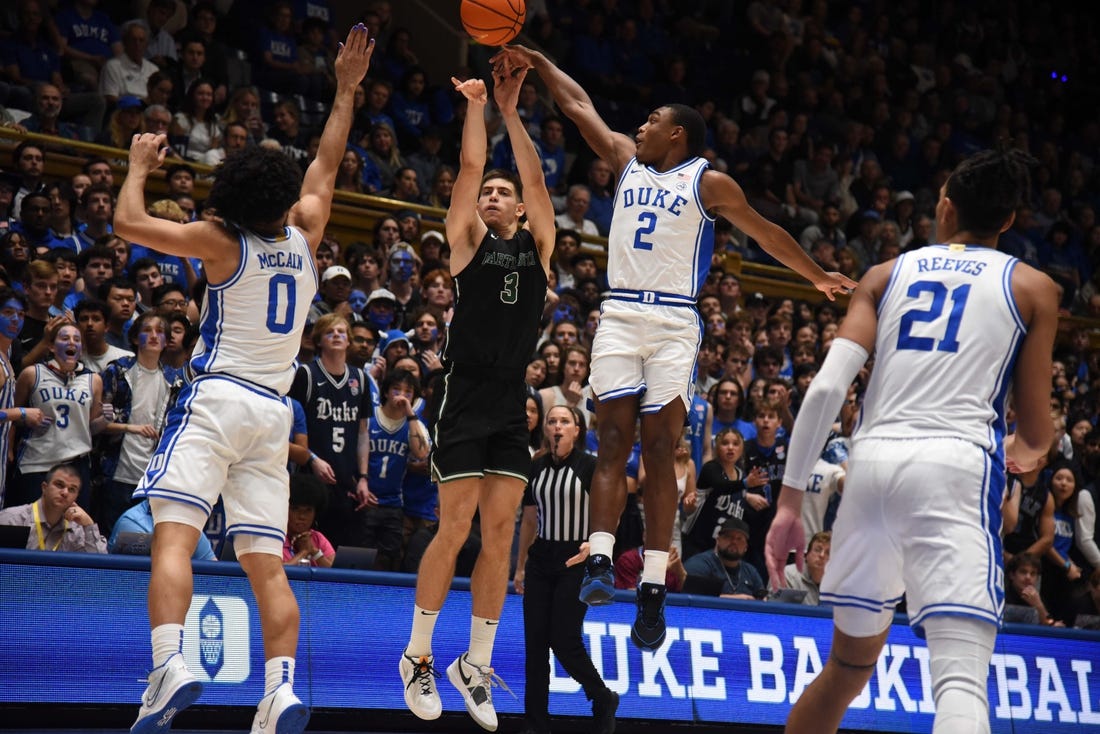 Nov 6, 2023; Durham, North Carolina, USA; Duke Blue Devils guard Jaylen Blakes (2) blocks the shot of Dartmouth Big Green forward Dusan Neskovic (3) during the first half at Cameron Indoor Stadium. Mandatory Credit: Rob Kinnan-USA TODAY Sports