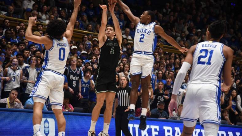 Nov 6, 2023; Durham, North Carolina, USA; Duke Blue Devils guard Jaylen Blakes (2) blocks the shot of Dartmouth Big Green forward Dusan Neskovic (3) during the first half at Cameron Indoor Stadium. Mandatory Credit: Rob Kinnan-USA TODAY Sports