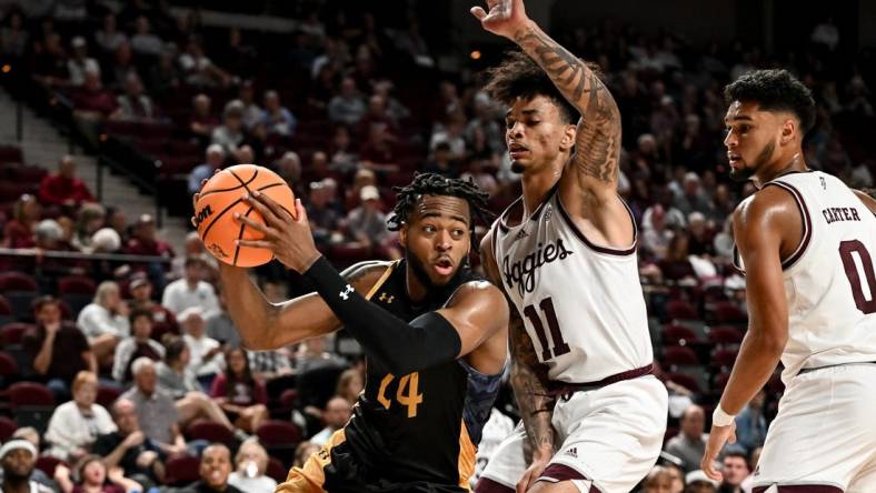 Nov 6, 2023; College Station, Texas, USA; Texas A&M Commerce forward Jerome Brewer Jr. (24) controls the ball as Texas A&M Aggies forward Andersson Garcia (11) defends during the first half at Reed Arena. Mandatory Credit: Maria Lysaker-USA TODAY Sports