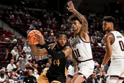Nov 6, 2023; College Station, Texas, USA; Texas A&M Commerce forward Jerome Brewer Jr. (24) controls the ball as Texas A&M Aggies forward Andersson Garcia (11) defends during the first half at Reed Arena. Mandatory Credit: Maria Lysaker-USA TODAY Sports