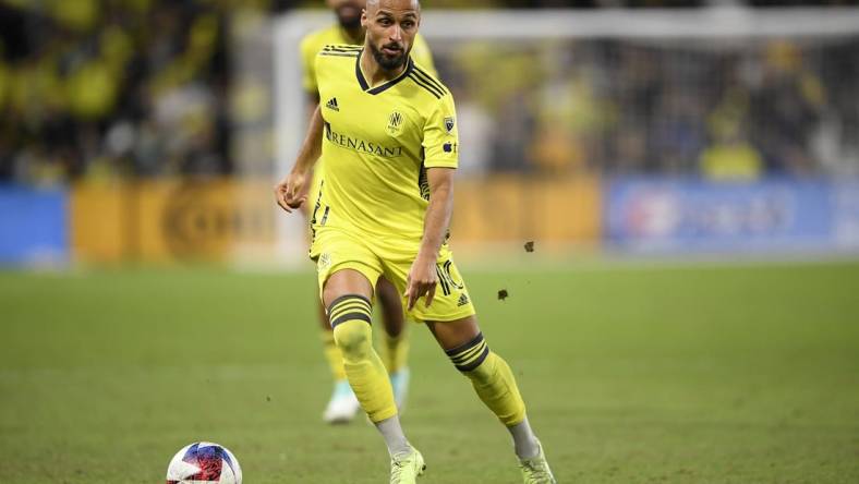 Nov 7, 2023; Nashville, Tennessee, USA; Nashville SC midfielder Hany Mukhtar (10) controls the ball in the second half against the Orlando City SC at Geodis Park. Mandatory Credit: Steve Roberts-USA TODAY Sports