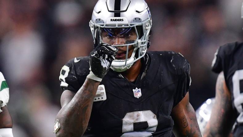 Nov 12, 2023; Paradise, Nevada, USA; Las Vegas Raiders running back Josh Jacobs (8) reacts after getting first down against the New York Jets during the second half at Allegiant Stadium. Mandatory Credit: Gary A. Vasquez-USA TODAY Sports