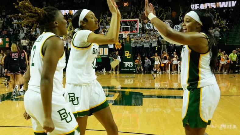 Nov 14, 2023; Waco, Texas, USA; Baylor Lady Bears guard Sarah Andrews (24) guard Darianna Littlepage-Buggs (5) and guard Yaya Felder (2) celebrate after defeating the Utah Utes at Ferrell Center. Mandatory Credit: Chris Jones-USA TODAY Sports