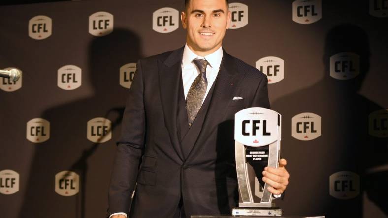 Nov 16, 2023; Niagra Falls, Ontario, CAN;  Toronto Argonauts quarterback Chad Kelly poses with the trophy after winning the George Reed Most Outstanding Player during the CFL Awards at Fallsview Casino & Resort. Mandatory Credit: Dan Hamilton-USA TODAY Sports