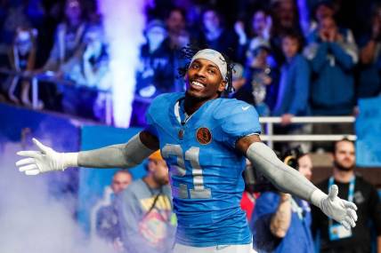 Detroit Lions safety Tracy Walker III (21) is being introduced before the Green Bay Packers game at Ford Field in Detroit on Thursday, Nov. 23, 2023.