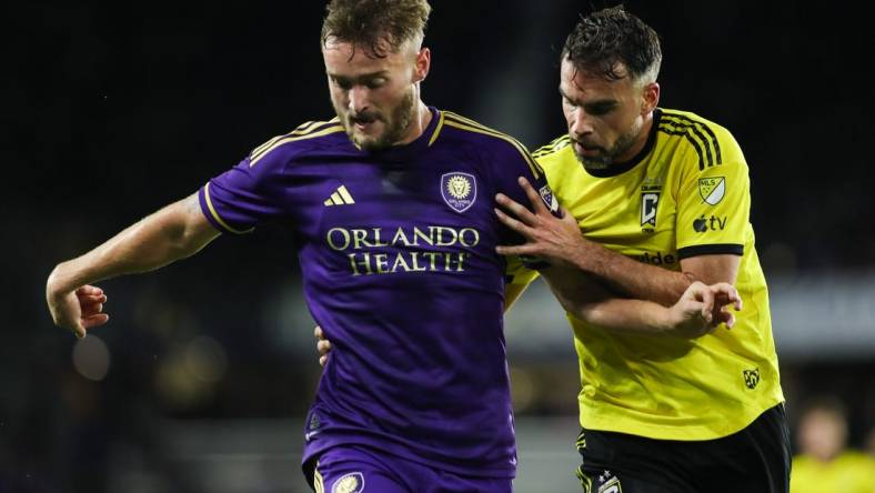 Nov 25, 2023; Orlando, Florida, USA; Orlando City forward Duncan McGuire (13) and Columbus Crew defender Rudy Camacho (4) battle for the ball during the second half in a MLS Cup Eastern Conference Semifinal match at Exploria Stadium. Mandatory Credit: Morgan Tencza-USA TODAY Sports