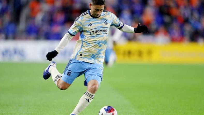 Nov 25, 2023; Cincinnati, Ohio, USA; Philadelphia Union midfielder Alejandro Bedoya (11) kicks the ball against FC Cincinnati during the first half in a MLS Cup Eastern Conference Semifinal match at TQL Stadium. Mandatory Credit: Joseph Maiorana-USA TODAY Sports