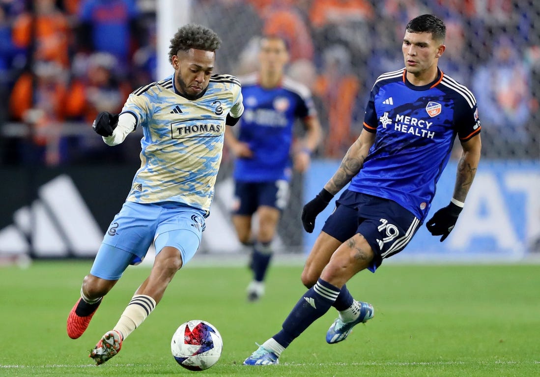 Nov 25, 2023; Cincinnati, Ohio, USA; Philadelphia Union forward Julian Carranza (9) dribbles the ball against FC Cincinnati forward Brandon Vazquez (19) during the second half in a MLS Cup Eastern Conference Semifinal match at TQL Stadium. Mandatory Credit: Joseph Maiorana-USA TODAY Sports