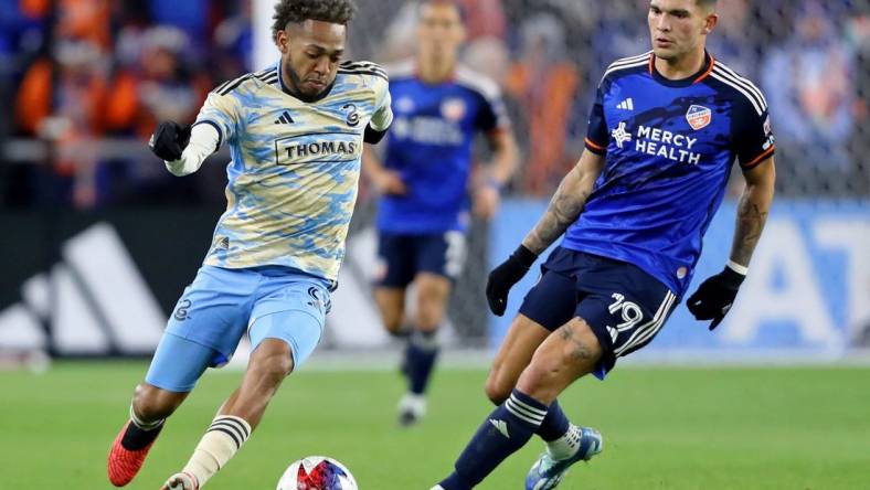 Nov 25, 2023; Cincinnati, Ohio, USA; Philadelphia Union forward Julian Carranza (9) dribbles the ball against FC Cincinnati forward Brandon Vazquez (19) during the second half in a MLS Cup Eastern Conference Semifinal match at TQL Stadium. Mandatory Credit: Joseph Maiorana-USA TODAY Sports