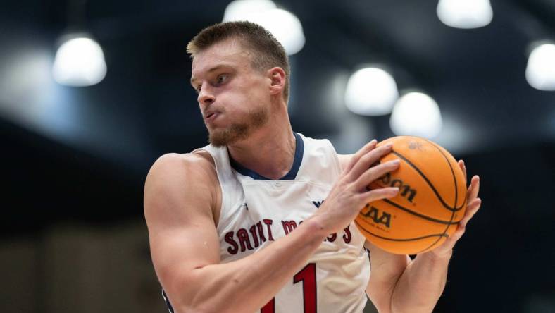 Nov 27, 2023; Moraga, California, USA;  St. Mary's Gaels center Mitchell Saxen (11) controls the ball during the second half against the Utah Utes at University Credit Union Pavilion. Mandatory Credit: Stan Szeto-USA TODAY Sports