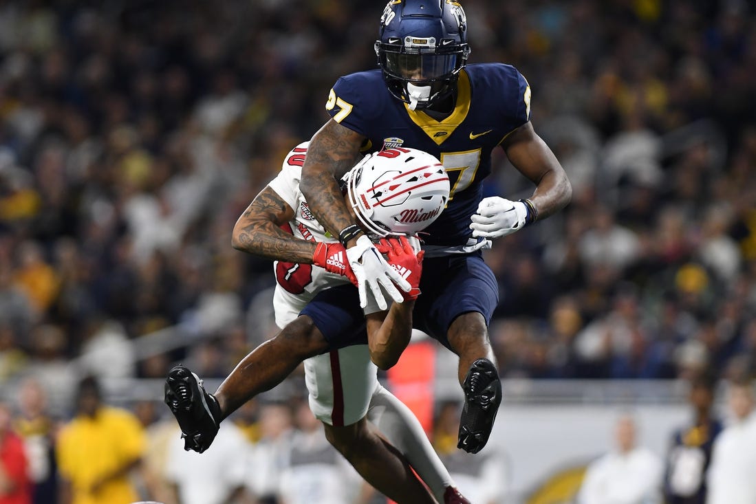 Toledo Rockets cornerback Quinyon Mitchell (27) breaks up a pass intended for Miami (OH) Redhawks wide receiver Gage Larvadain (10) in the third quarter at Ford Field. Mandatory Credit: Lon Horwedel-USA TODAY Sports