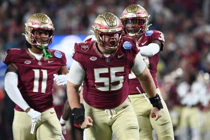 Dec 2, 2023; Charlotte, NC, USA; Florida State Seminoles defensive lineman Braden Fiske (55) reacts after a tackle on Louisville Cardinals running back Jawhar Jordan (25) in the first quarter at Bank of America Stadium. Mandatory Credit: Bob Donnan-USA TODAY Sports