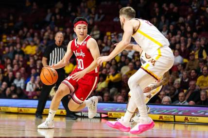 Dec 6, 2023; Minneapolis, Minnesota, USA; Nebraska Cornhuskers guard Keisei Tominaga (30) works around Minnesota Golden Gophers forward Parker Fox (23) during the second half at Williams Arena. Mandatory Credit: Matt Krohn-USA TODAY Sports