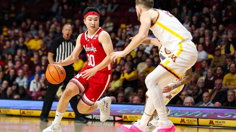 Dec 6, 2023; Minneapolis, Minnesota, USA; Nebraska Cornhuskers guard Keisei Tominaga (30) works around Minnesota Golden Gophers forward Parker Fox (23) during the second half at Williams Arena. Mandatory Credit: Matt Krohn-USA TODAY Sports