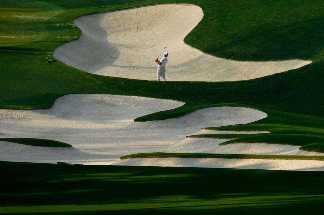 Gary Woodland hits out of a bunker on no. 10 during a practice round for The Masters golf tournament at Augusta National Golf Club on Apr 5, 2023.