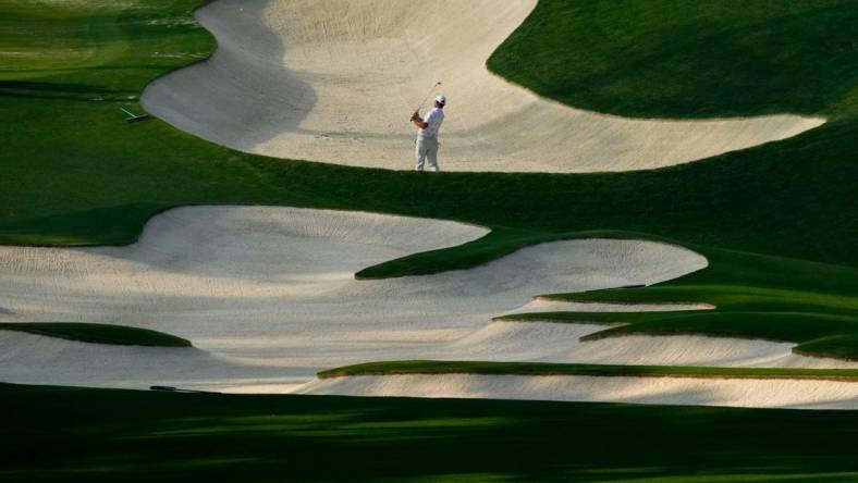 Gary Woodland hits out of a bunker on no. 10 during a practice round for The Masters golf tournament at Augusta National Golf Club on Apr 5, 2023.