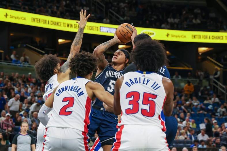 Dec 8, 2023; Orlando, Florida, USA; Orlando Magic forward Paolo Banchero (5) shoots the ball against the Detroit Pistons during the second quarter at Amway Center. Mandatory Credit: Mike Watters-USA TODAY Sports