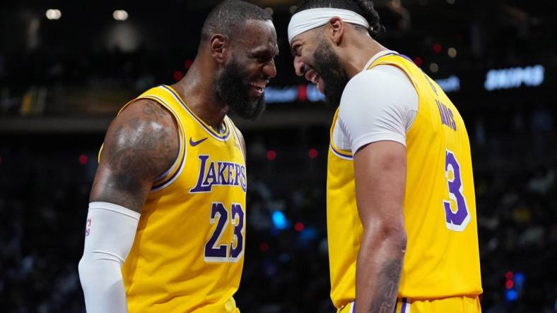 Dec 9, 2023; Las Vegas, Nevada, USA; Los Angeles Lakers forward LeBron James (23) and forward Anthony Davis (3) celebrate after winning the in season tournament championship final against the Indiana Pacers at T-Mobile Arena. Mandatory Credit: Kyle Terada-USA TODAY Sports