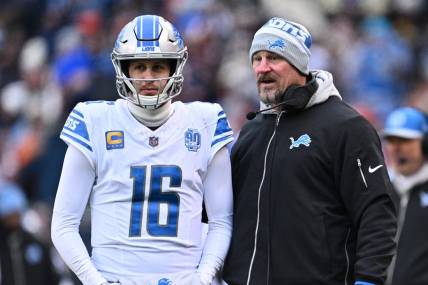 Dec 10, 2023; Chicago, Illinois, USA;  Detroit Lions head coach Dan Campbell talks with quarterback Jared Goff (16) in the first half against the Chicago Bears at Soldier Field. Mandatory Credit: Jamie Sabau-USA TODAY Sports