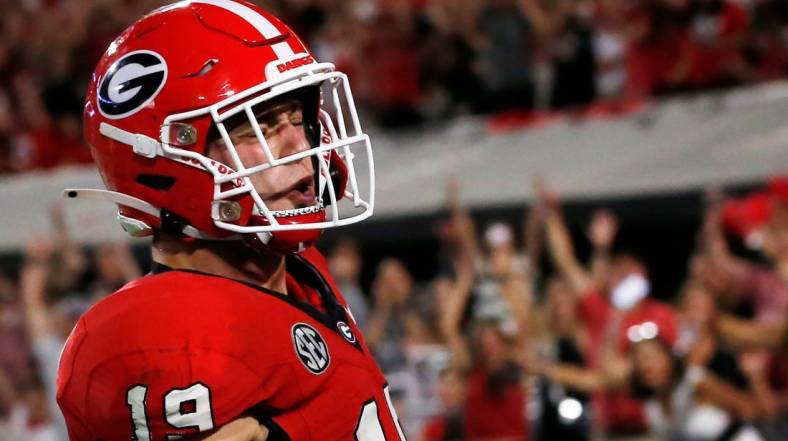 Georgia tight end Brock Bowers (19) celebrates after scoring a touchdown during the first half of a NCAA college football game against UAB in Athens, Ga., on Saturday, Sept. 23, 2023.