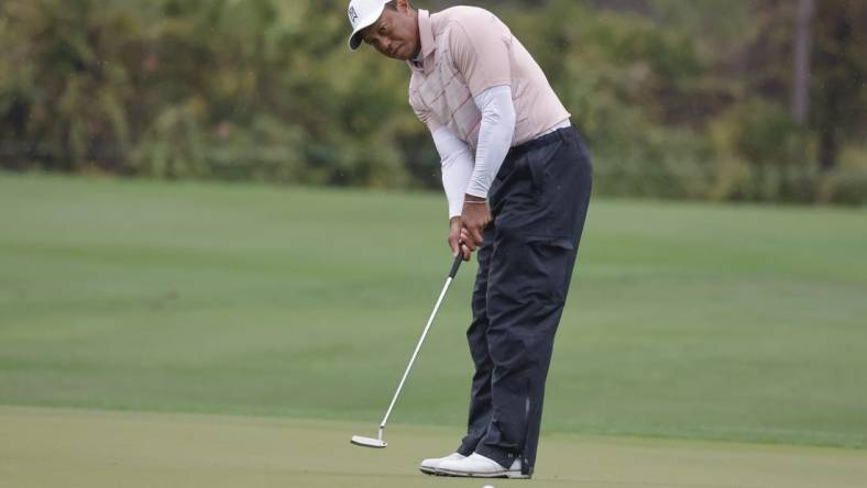 Dec 16, 2023; Orlando, Florida, USA; Tiger Woods putts on the fifth green during the PNC Championship at The Ritz-Carlton Golf Club. Mandatory Credit: Reinhold Matay-USA TODAY Sports