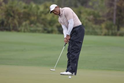 Dec 16, 2023; Orlando, Florida, USA; Tiger Woods putts on the fifth green during the PNC Championship at The Ritz-Carlton Golf Club. Mandatory Credit: Reinhold Matay-USA TODAY Sports