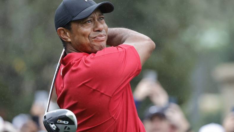 Dec 17, 2023; Orlando, Florida, USA;  Tiger Woods plays his shot from the first tee during the PNC Championship at The Ritz-Carlton Golf Club. Mandatory Credit: Reinhold Matay-USA TODAY Sports