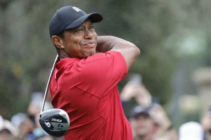 Dec 17, 2023; Orlando, Florida, USA;  Tiger Woods plays his shot from the first tee during the PNC Championship at The Ritz-Carlton Golf Club. Mandatory Credit: Reinhold Matay-USA TODAY Sports